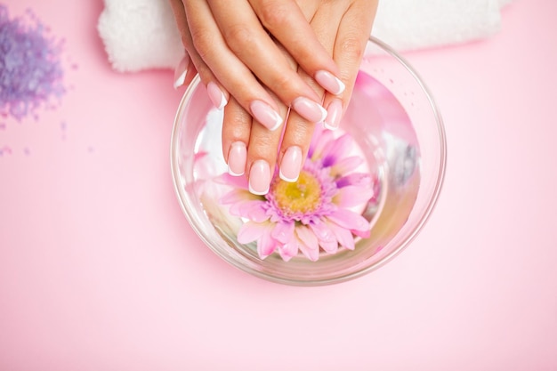 Woman hands receiving a manicure in beauty salon