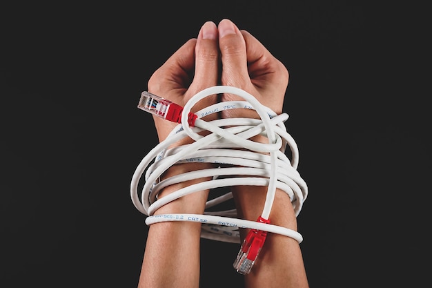 Woman hands tied with network cable