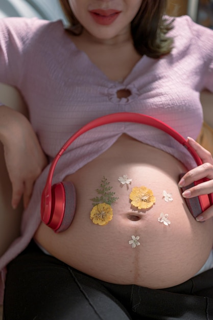 Photo woman hands touching naked belly isolated on light gray background emotional loving pregnancy time 37 weeks baby expectation side view banner empty place for text quote saying closeup