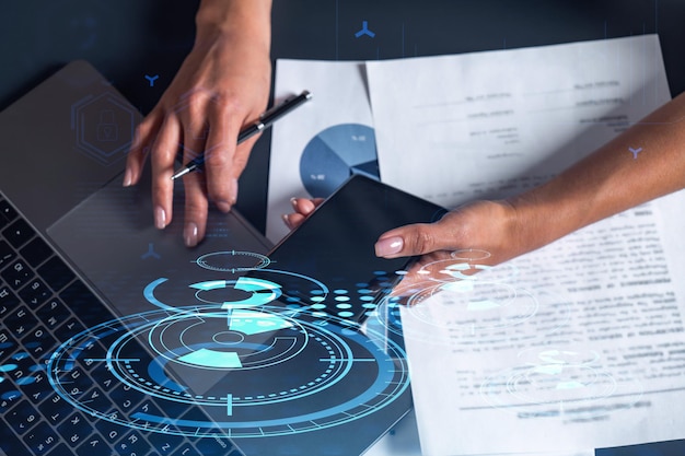 Woman hands typing the keyboard to create innovative software
to change the world and provide a completely new service close up
shot hologram tech graphs concept of dev team casual wear