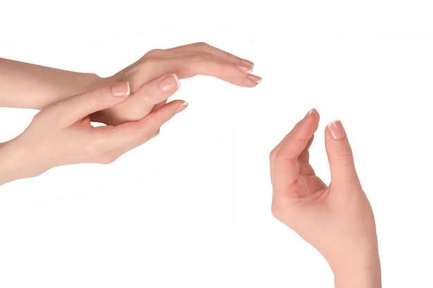 Woman hands with french manicure isolated on white bacckground