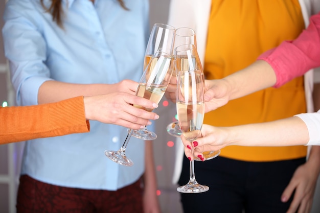 Woman hands with glasses of champagne