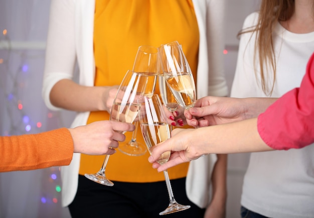 Woman hands with glasses of champagne