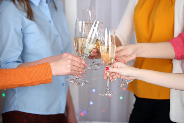 Woman hands with glasses of champagne