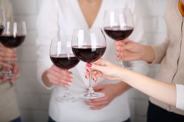 Woman hands with glasses of wine close-up