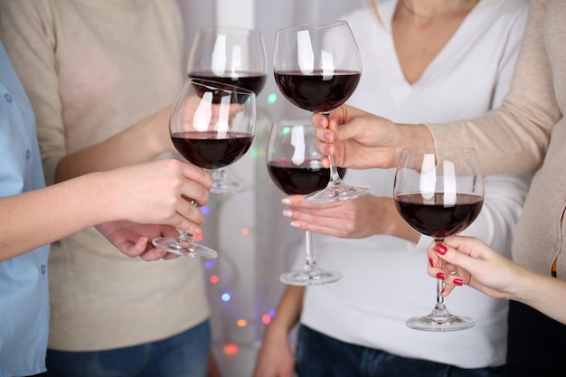 Woman hands with glasses of wine close-up