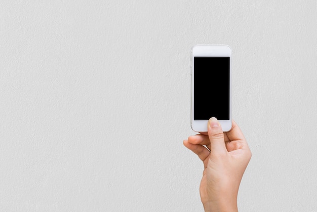 Photo woman hands with wall cell phone, mock up