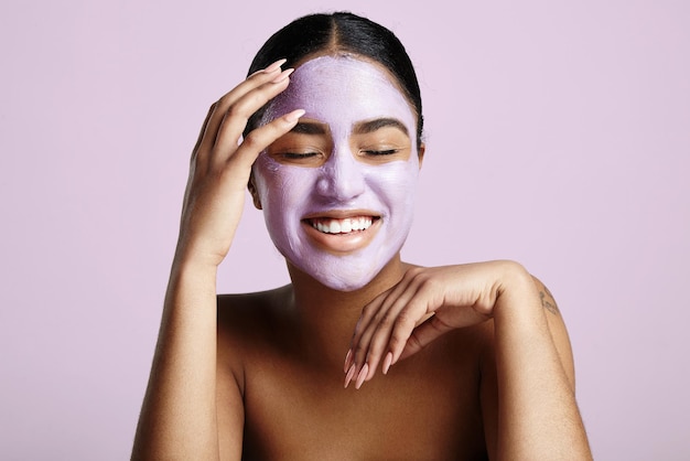 Woman has fun with a facial mask