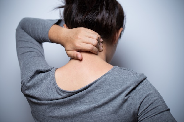 Woman has neck pain