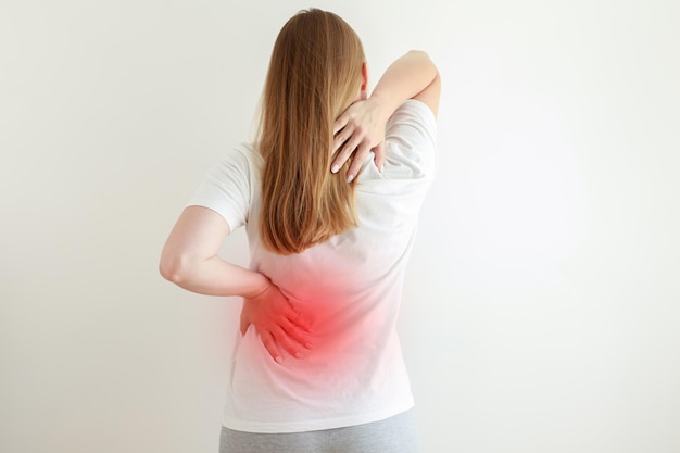 Woman has pain in her back and lower back