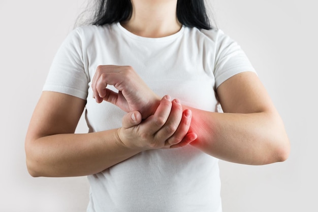 A woman has pain in her wrist