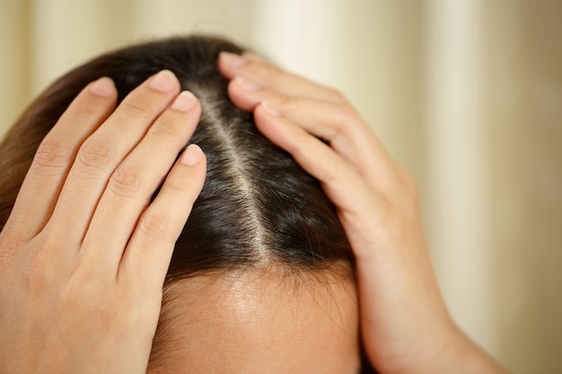 A woman has problems with hair and scalp