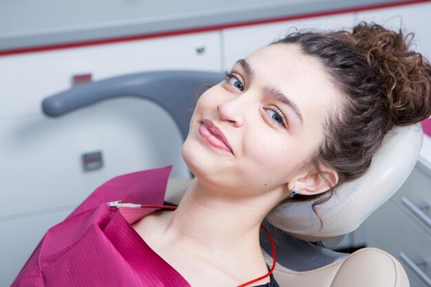 Woman have teeth examination at dentistry clinic Closeup young caucasian girl face