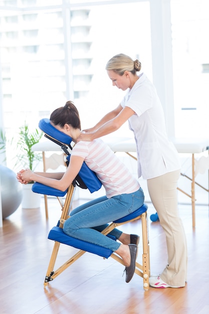 Woman having back massage