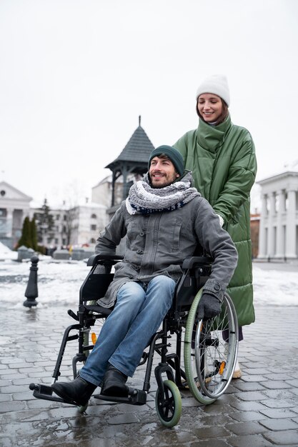 Woman having fun with her her disabled friend