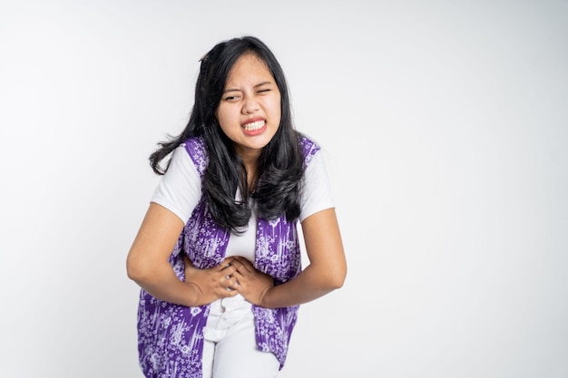 Woman having her period holding her stomach in pain