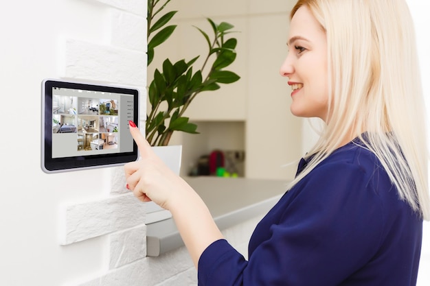 Woman having a Home automation control station in a modern home 3D render.