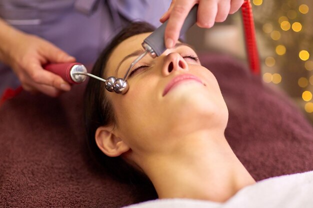 woman having hydradermie facial treatment in spa