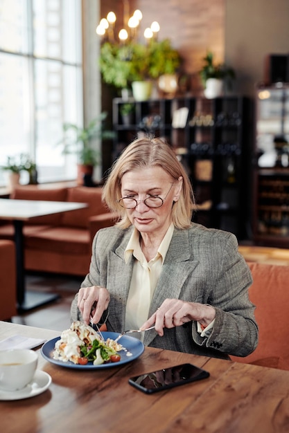 Woman having lunch at the cafe