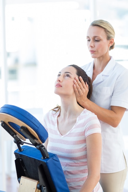 Woman having neck massage