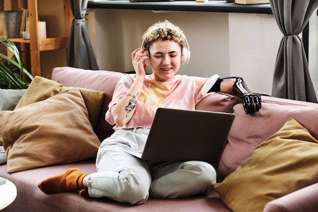 Woman having online conversation on laptop