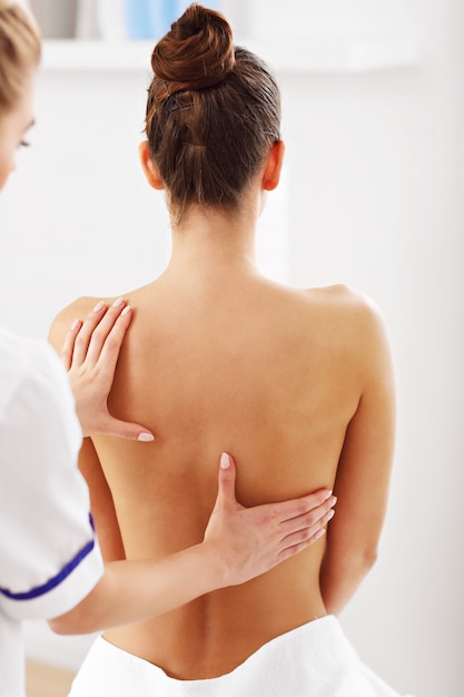 A woman having professional back therapy