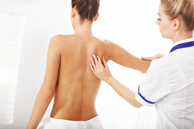 A woman having professional back therapy