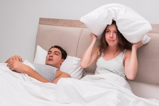 Woman having trouble with husband snoring