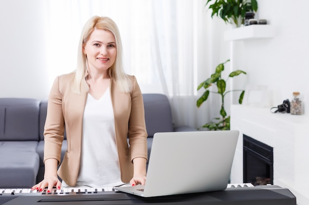 woman having video chat with friends and playing music