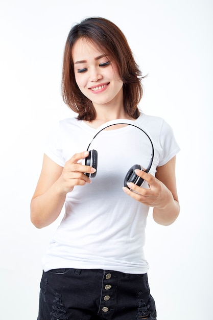 Woman headphones listening music on white