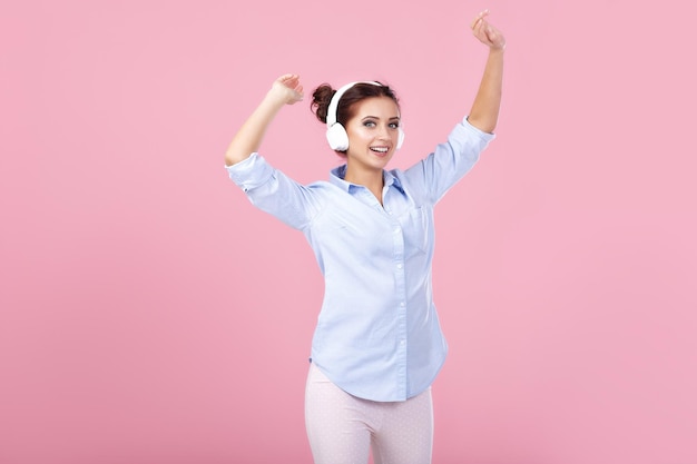 Woman in headphones listening to music