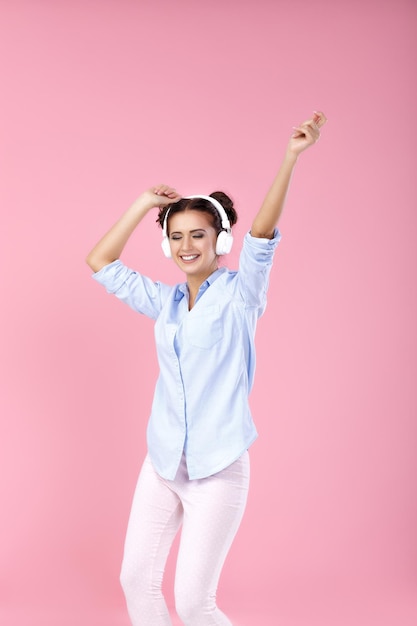 Woman in headphones listening to music