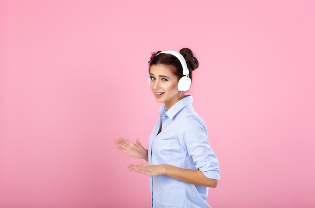 Woman in headphones listening to music