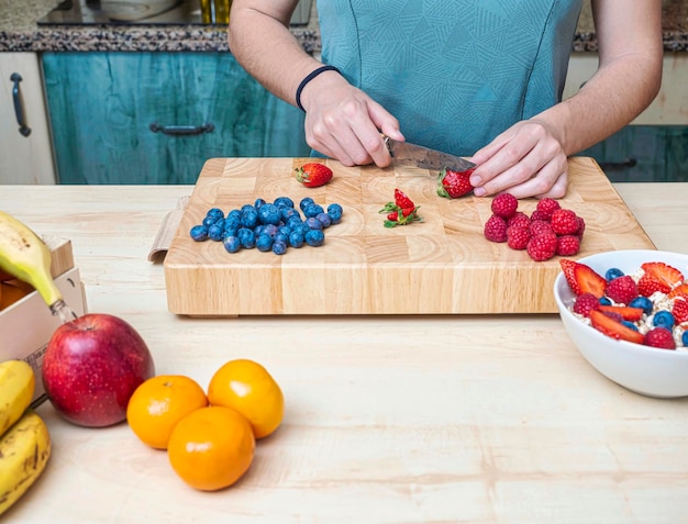 Woman in her kitchen preparing a healthy snack