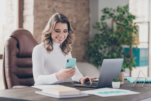 woman in her office working on laptop