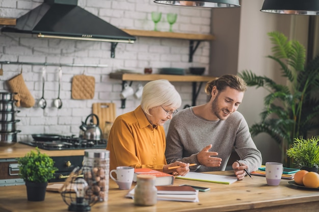 Woman and her son looking busy