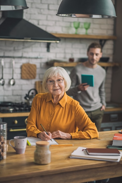 Woman and her son looking busy