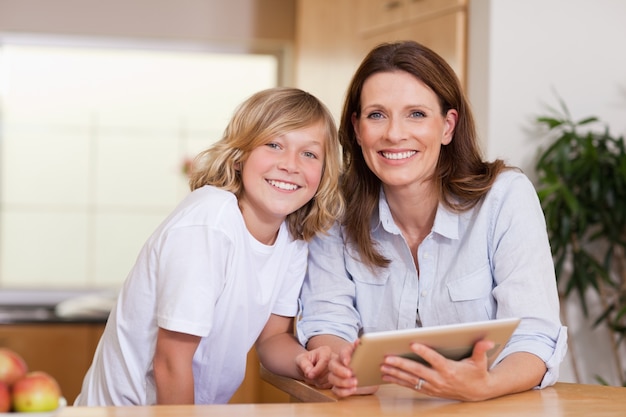 Woman and her son using tablet