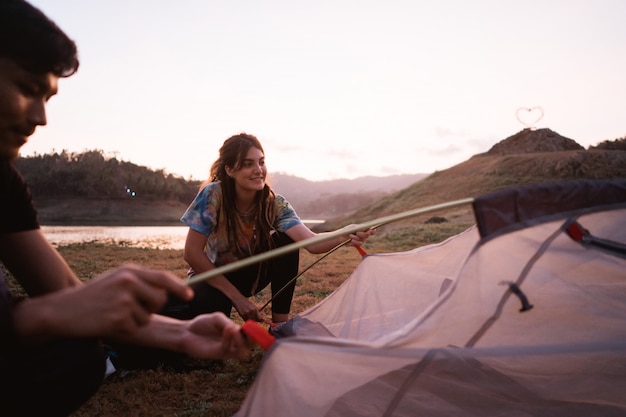 Woman hiker prepare make a tent