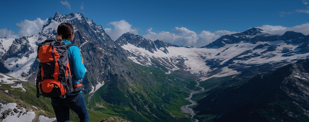 Woman hiker on a top of a mountain