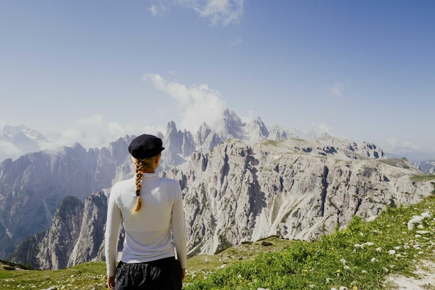 Woman hiking in the dolomite mountains