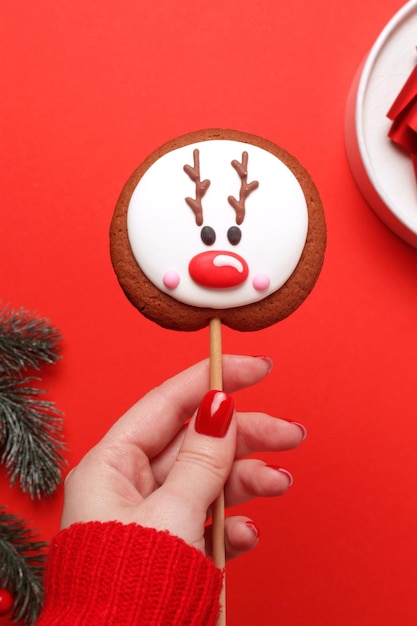 Woman hold in hand a traditional gingerbread Christmas and New Year holidays mood