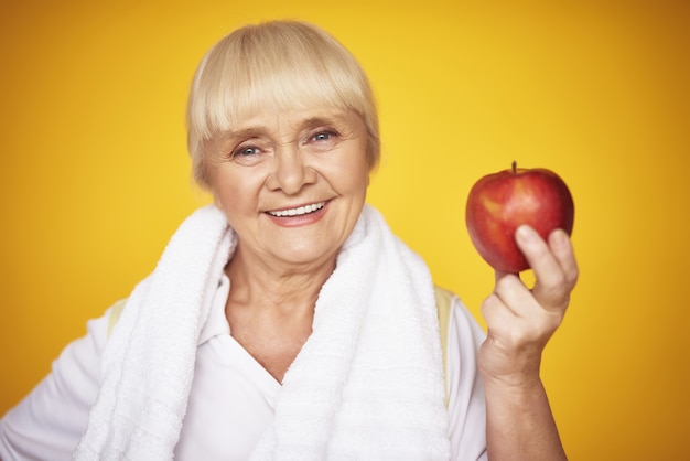 Woman Holding Apple Elderly Fitness Woman Diet.