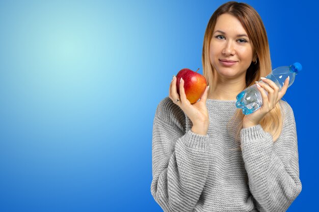 Woman holding apple