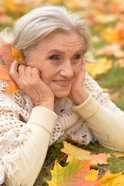 Woman holding autumn leaf