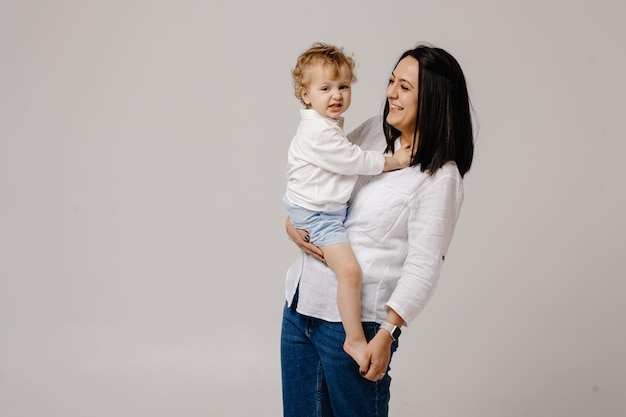 A woman holding a baby in her arms.