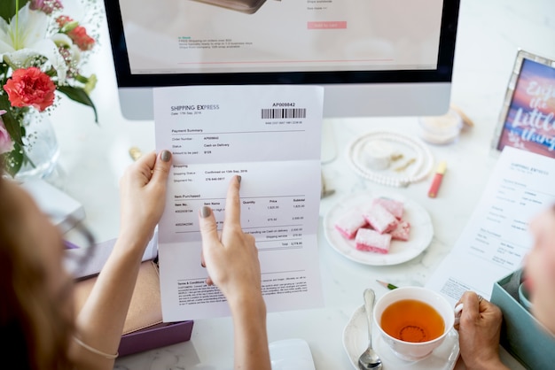 Woman holding bill payment