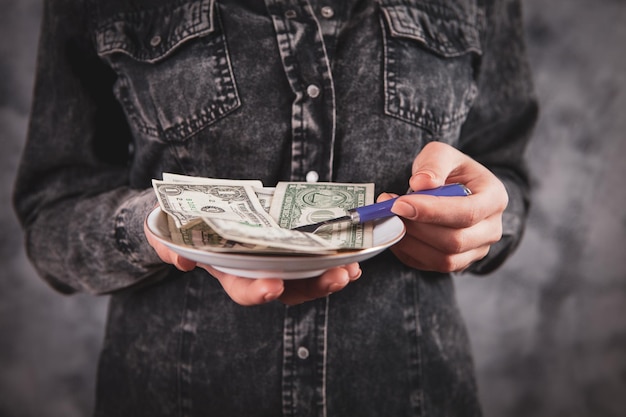 Woman holding a bill with a fork