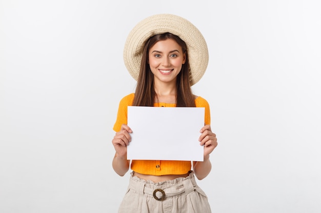 Woman holding blank card. Isolated on white smiling female portrait