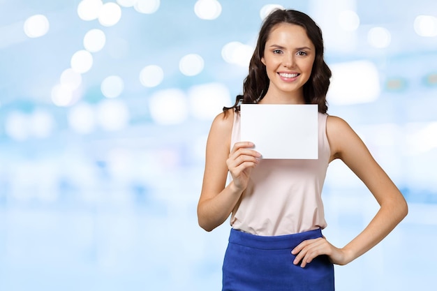 Woman holding blank card